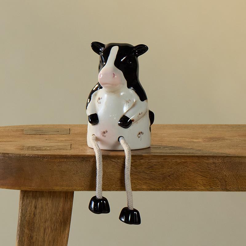 Ceramic Cow Sitter