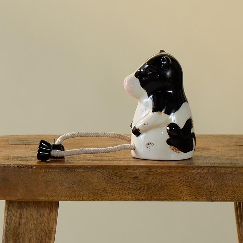 Ceramic Cow Sitter